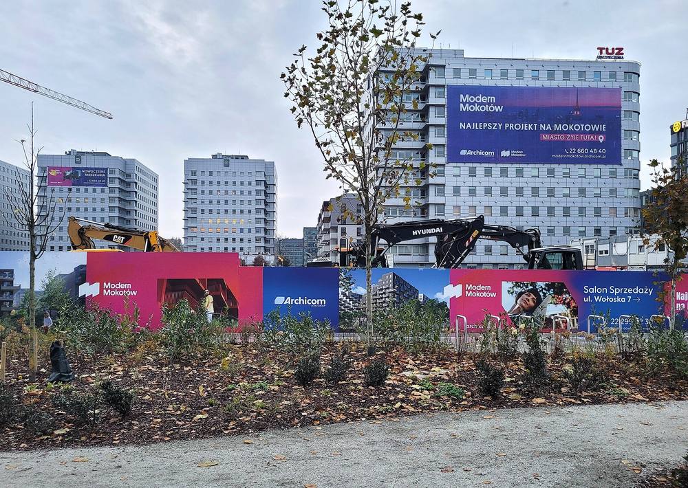 Excavators and earthmoving equipment on a commercial development lot